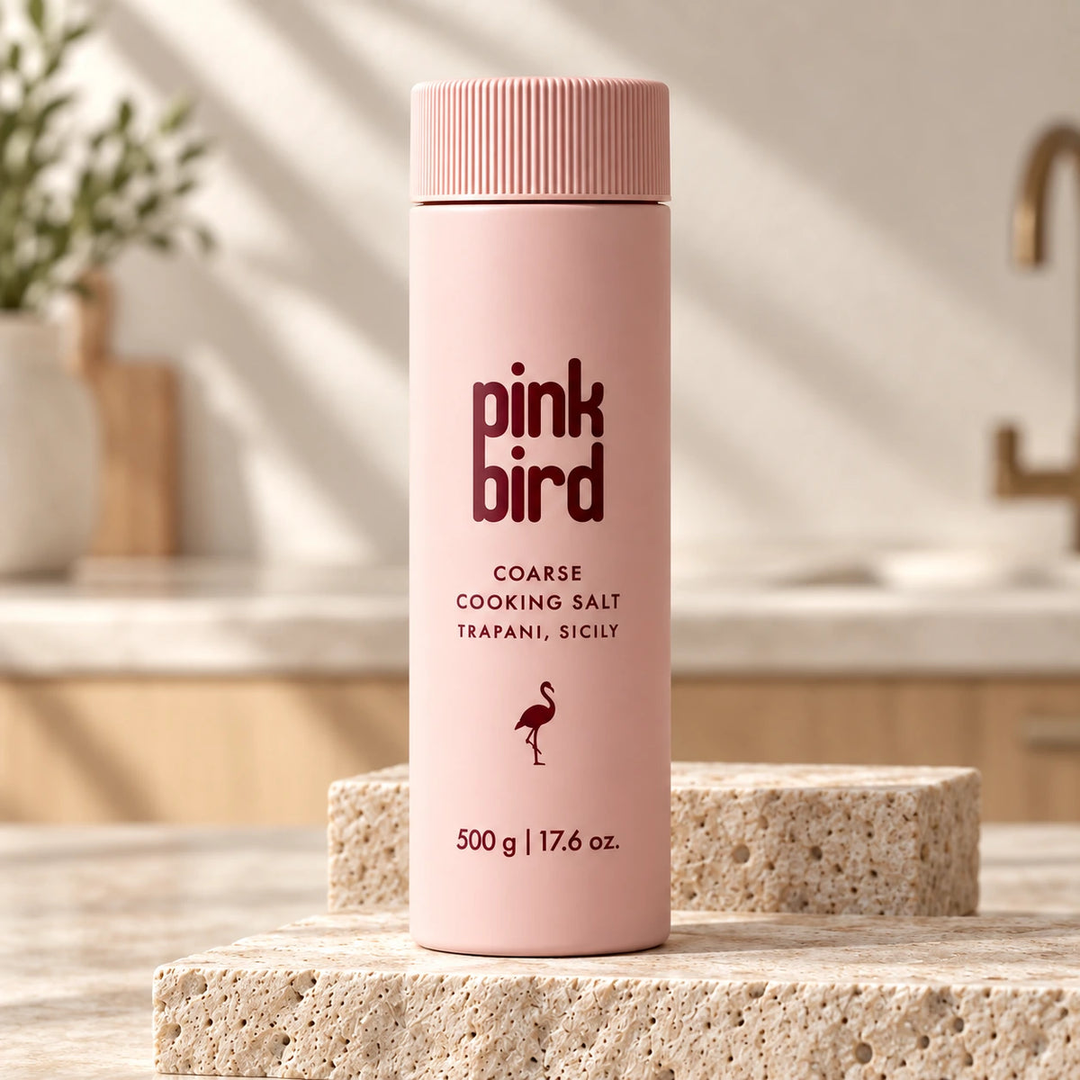 Pink Bird 500 g coarse cooking salt bottle on a travertine counter