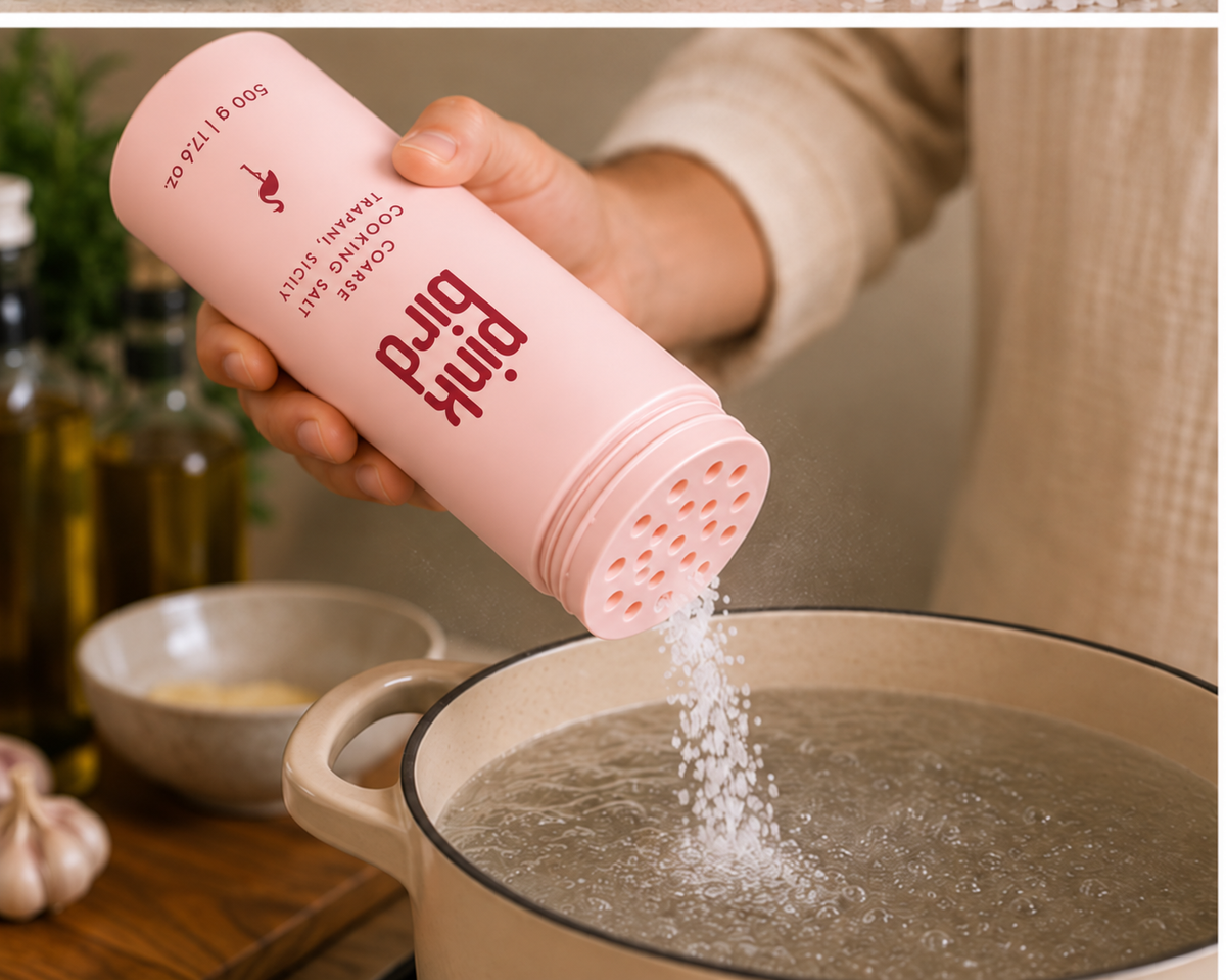 Coarse cooking salt pouring into pasta water